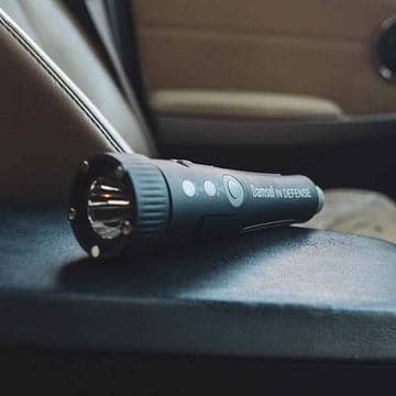 Auto emergency tool resting on a car window sill